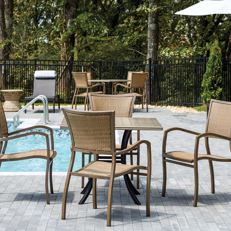 wooden patio furniture by the pool