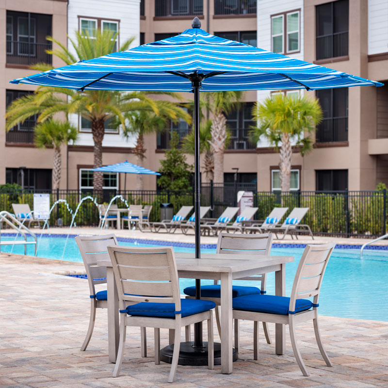 umbrella and patio set by the pool