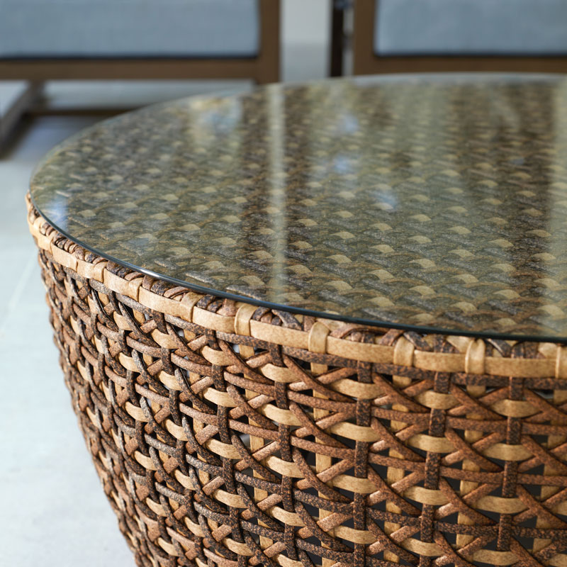 close up of wooden end table braided detail with glass top